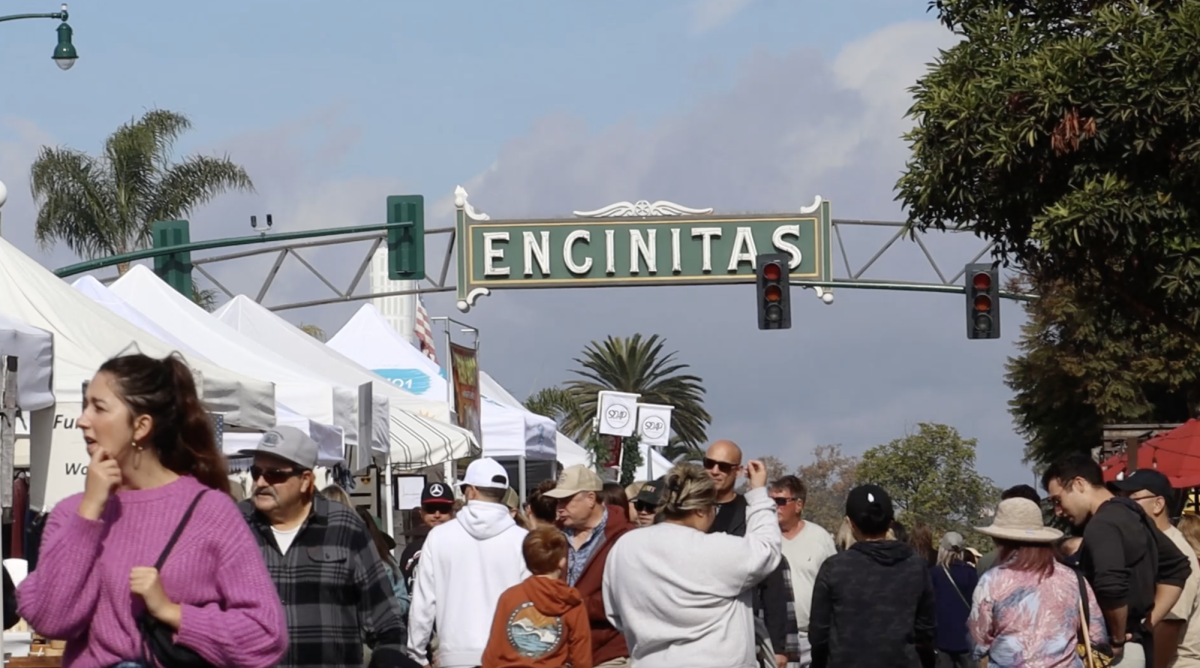 Reporters interview local vendors at the Encinitas Holiday Market. The market took place the last weekend in November. Photo courtesy of Nickolas Sanchez-Kishko. 